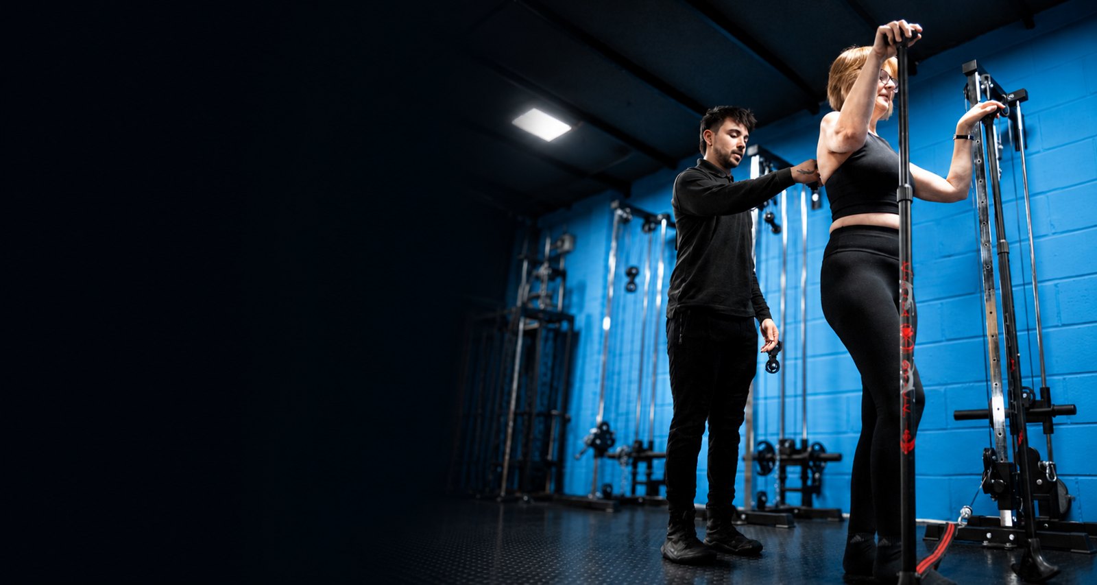 Essex Biomechanics coach guiding a client's movement in the studio